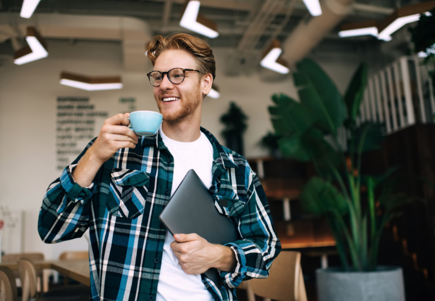 Male worker drinking tea in the office