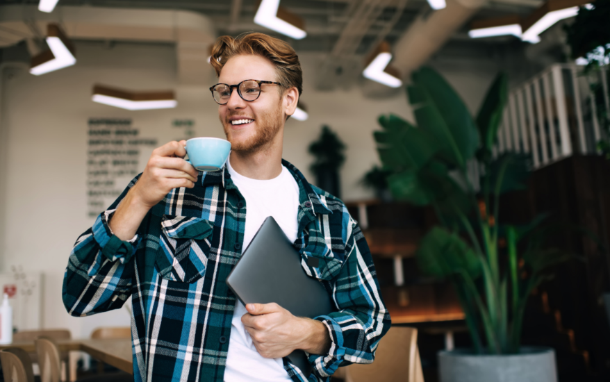 Male worker drinking tea in the office