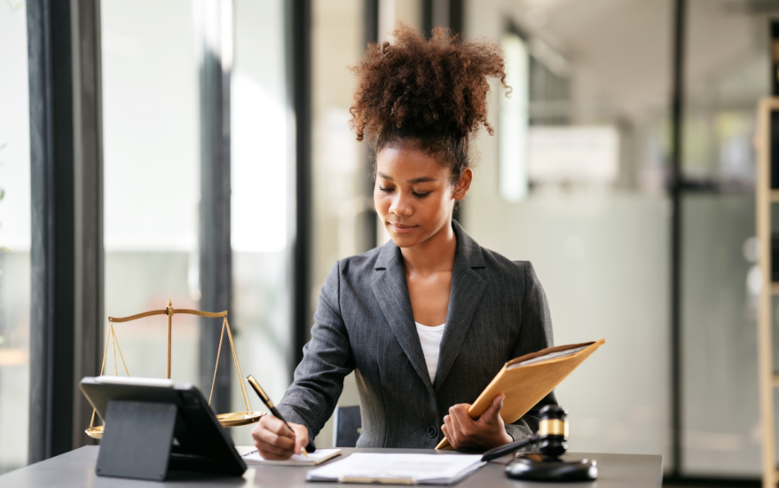 Female lawyer holding a business envelope